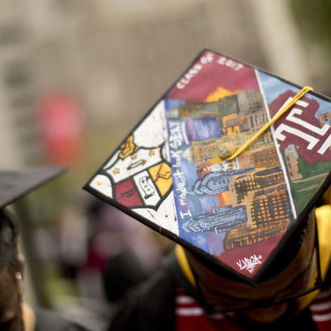 Image of a Temple graduate in their cap.
