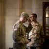 Students in military uniforms at the entrance of Sullivan Hall