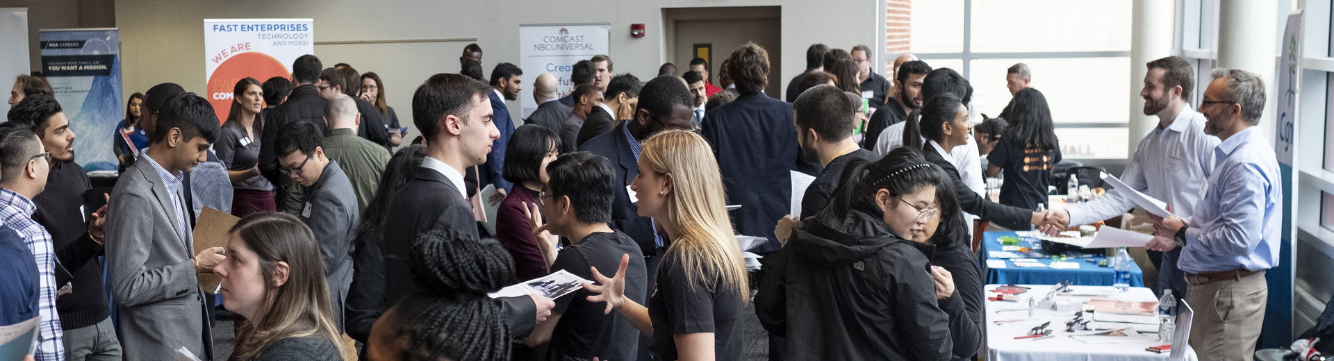 Crowd of employers and students at a career fair