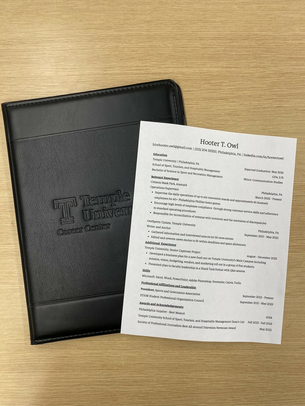 Picture of resume and padfolio from Temple Career Center